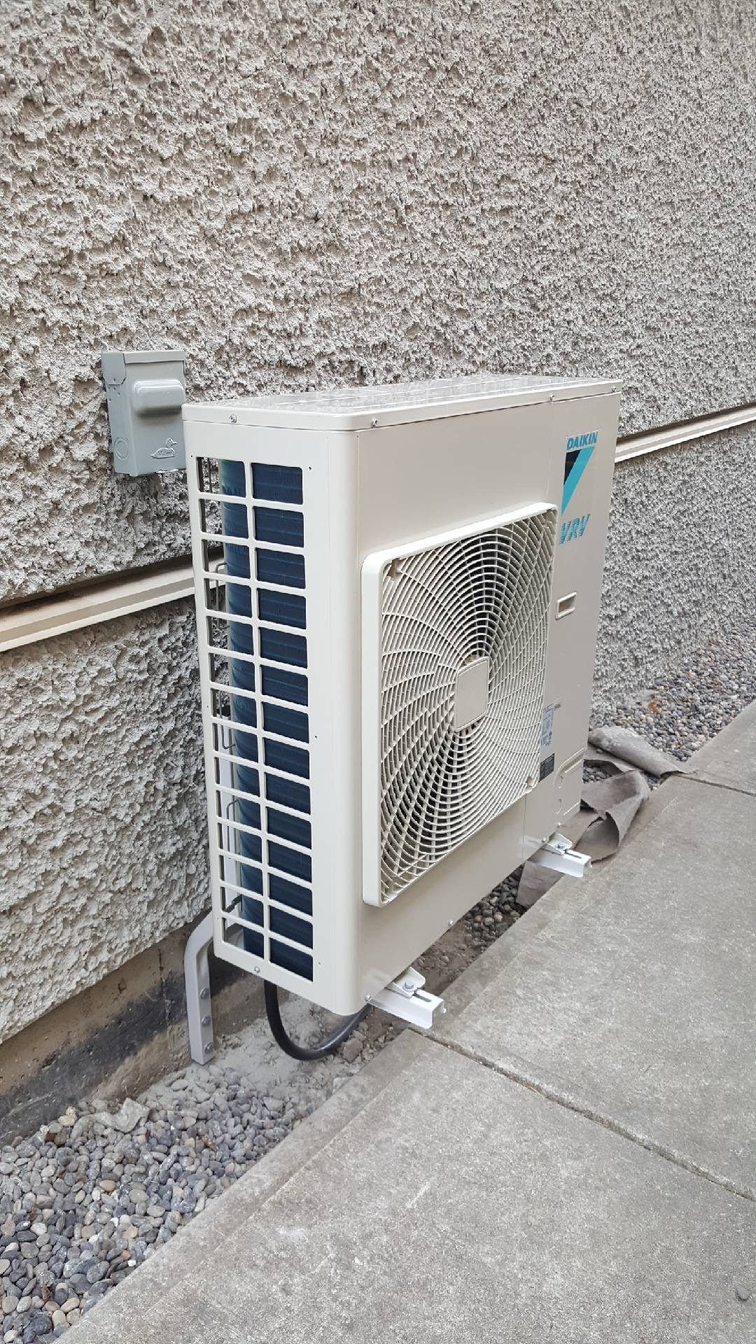 Daikin VRV outdoor unit mounted on foundation brackets
